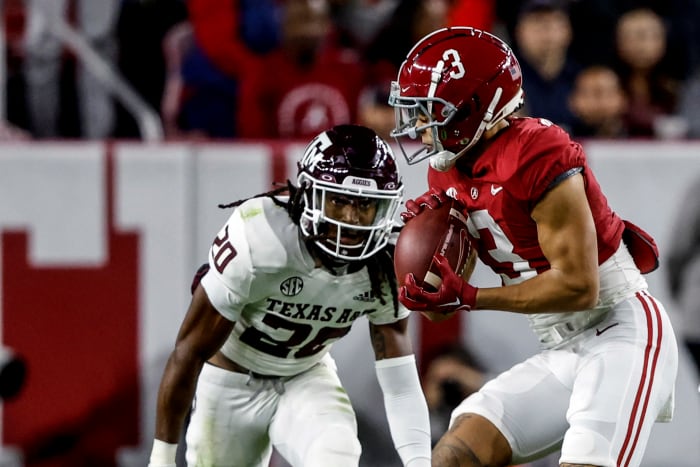 Texas A&M Aggies defensive back Jardin Gilbert (No. 20) makes an open-field tackle against Alabama receiver Jermain Burton (No. 3) in a 24-20 loss at Bryant-Denny Stadium in Tuscaloosa, Ala.
